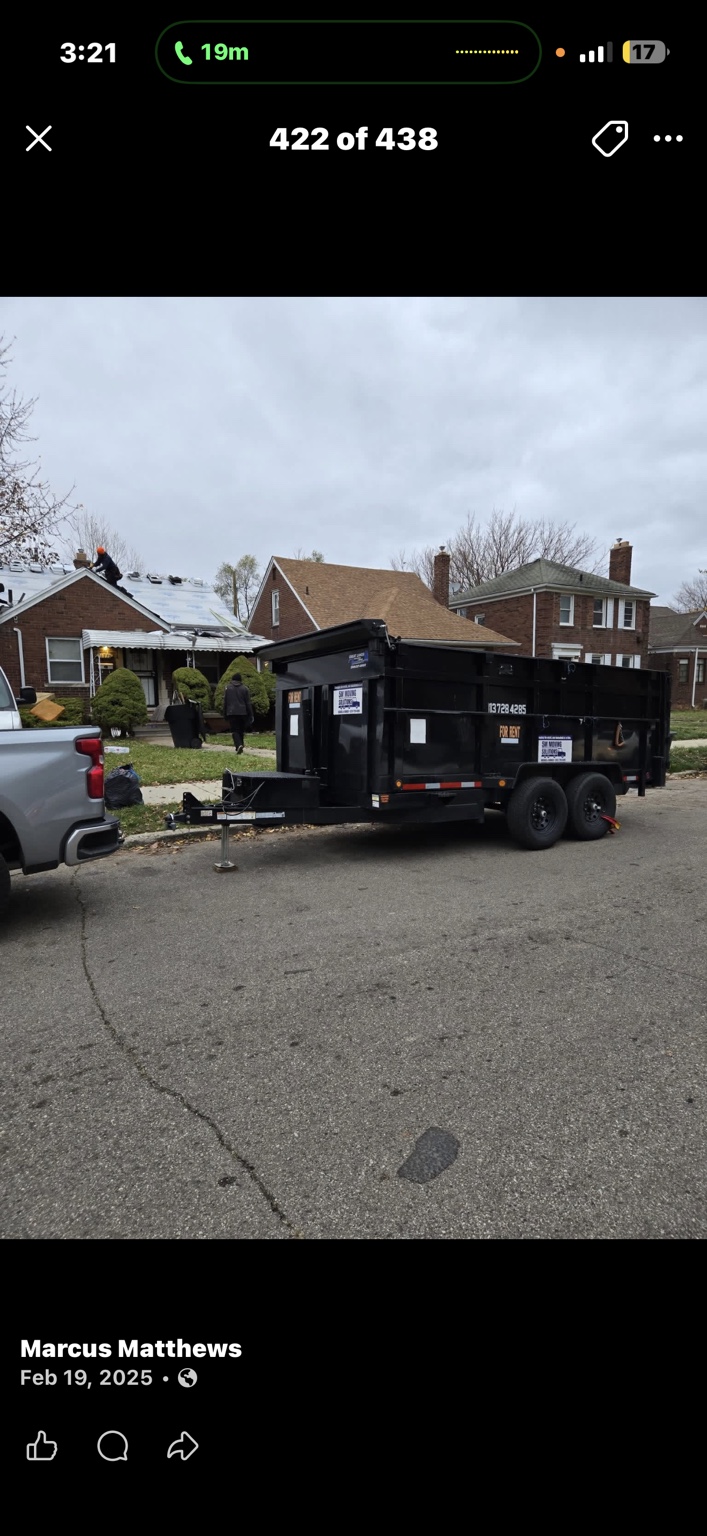 A hauling trailer parked on a residential street