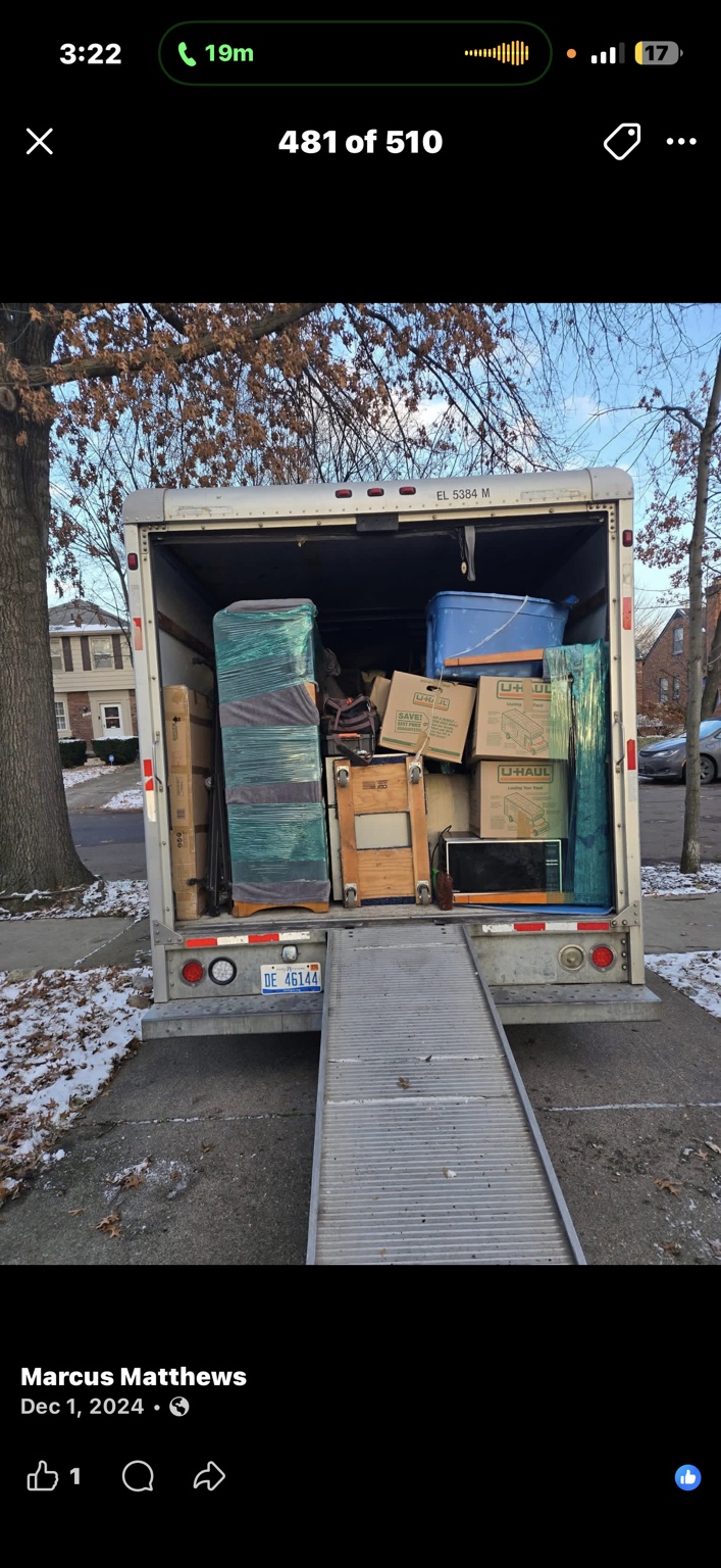 Wrapped furniture and boxes loaded into a moving truck